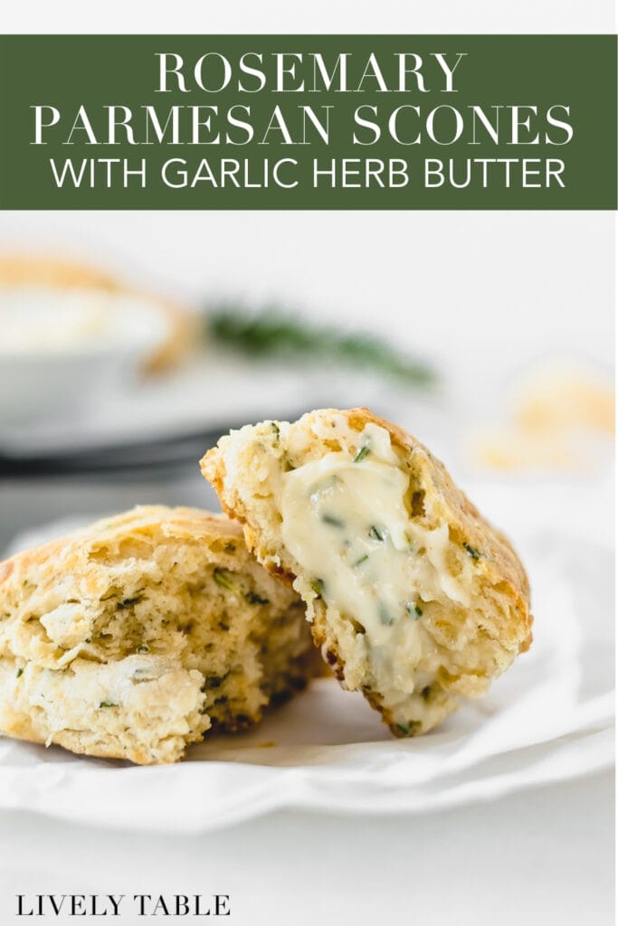 rosemary parmesan scone broken in half and spread with garlic herb butter with text overlay.