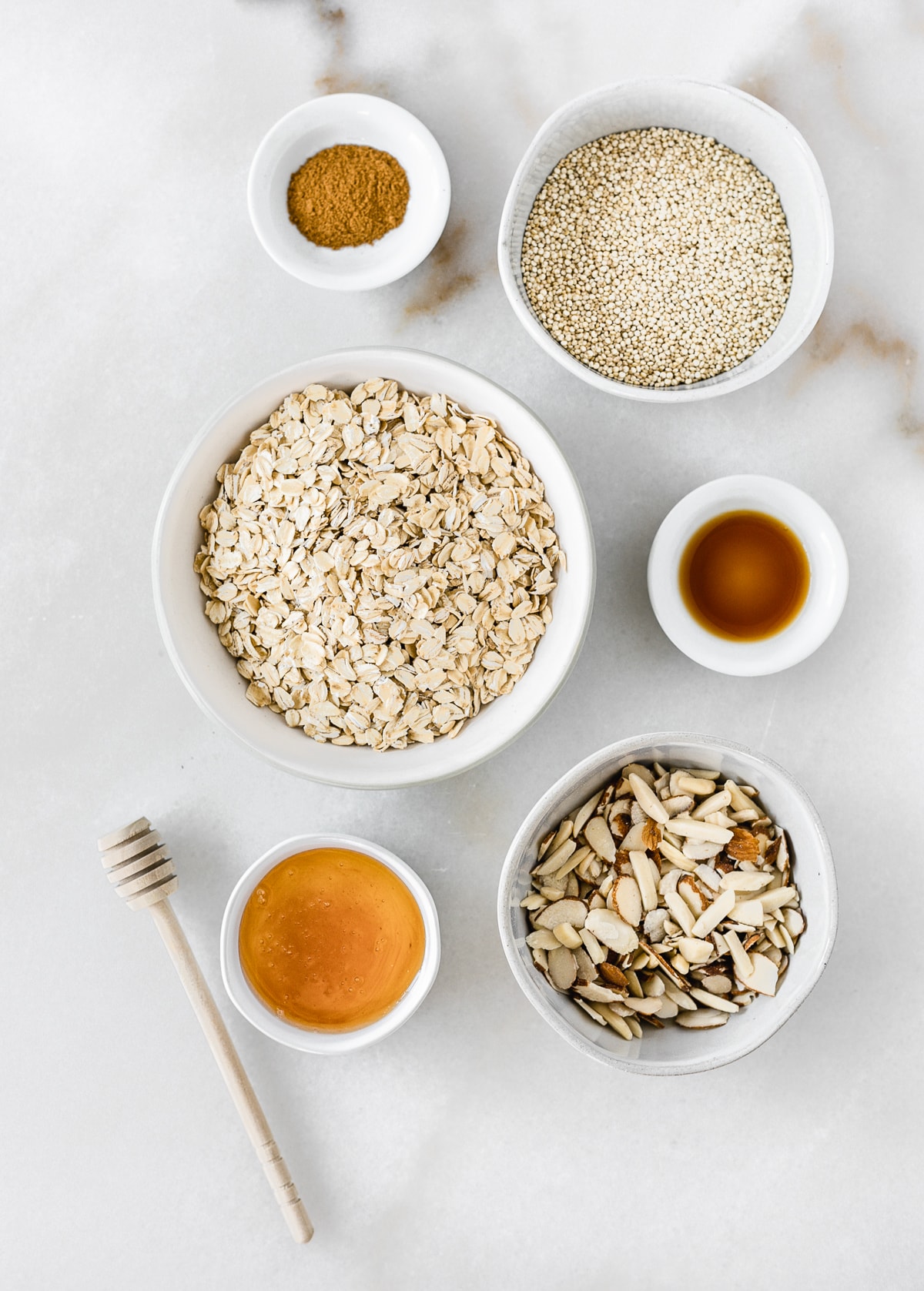 Overhead view of ingredients needed to make honey almond quinoa granola.