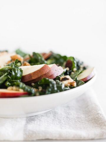 fall kale salad with sorghum, apples, pears, and cranberries