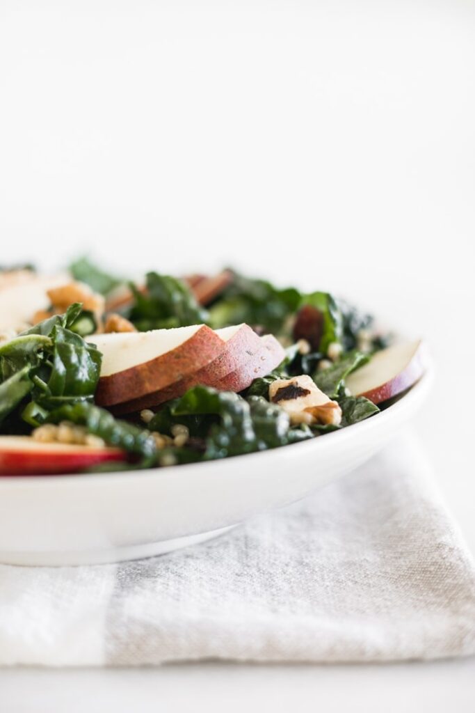 fall kale salad with sorghum, apples, pears, and cranberries