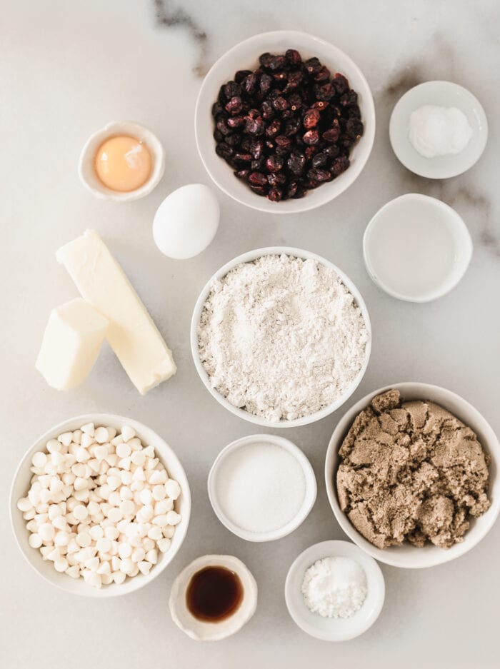overhead view of ingredients needed to make white chocolate cranberry bliss cookies.