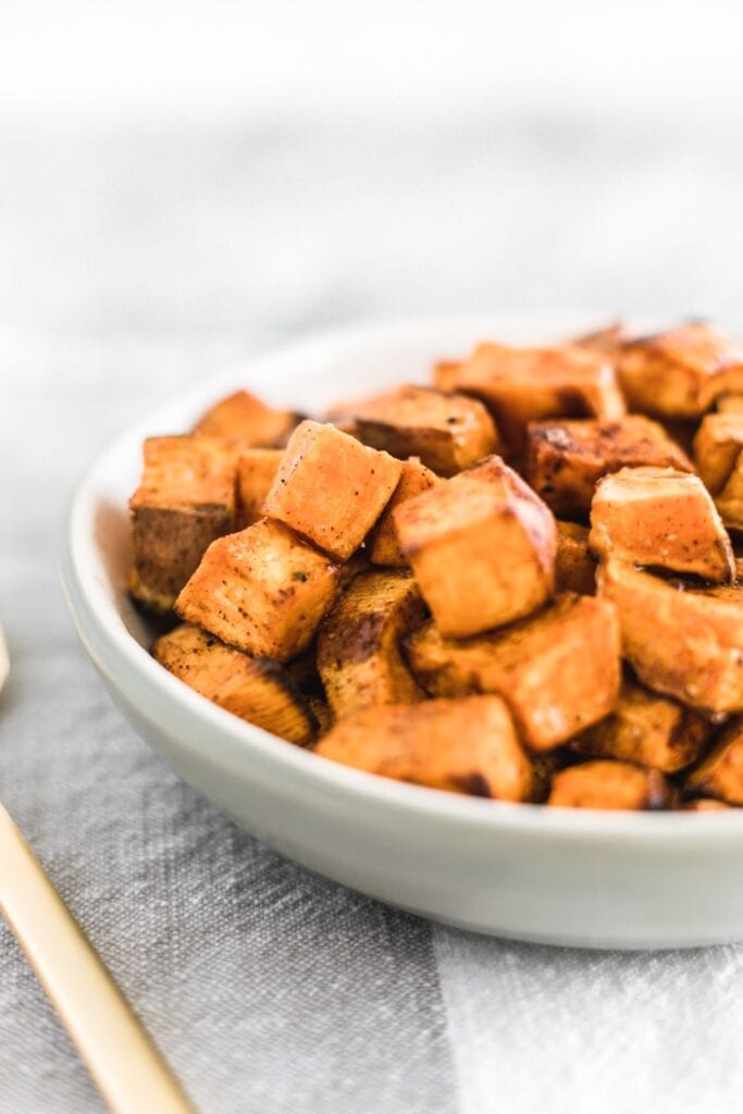 closeup of simple roasted sweet potato cubes in a great bowl