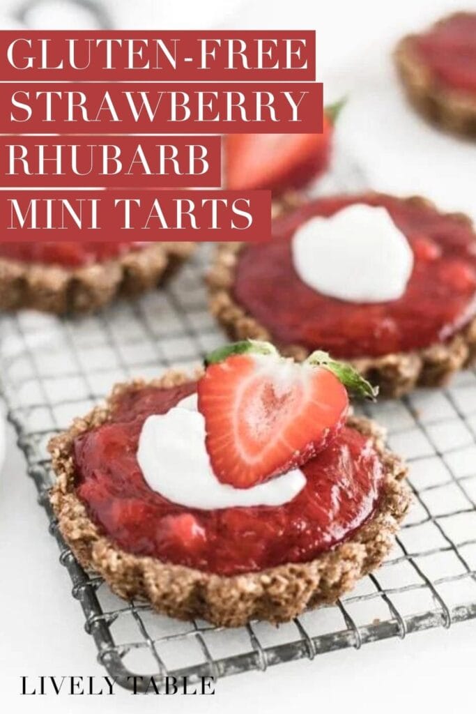 strawberry rhubarb tartlets with gluten free pecan crust on a wire rack with text overlay.