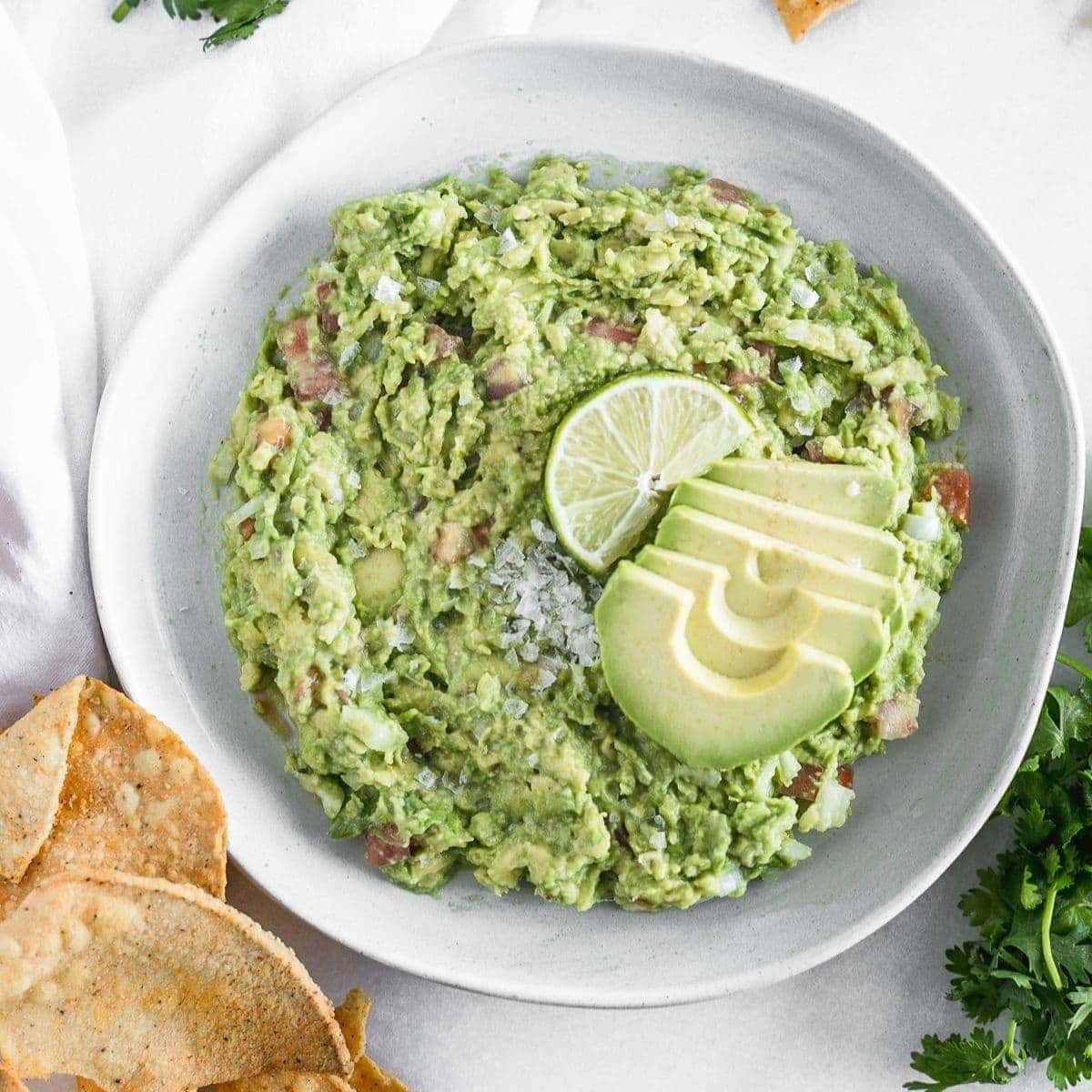 This easy guacamole recipe has just a few simple ingredients and is the perfect healthy dip to accompany any Tex-Mex dish! (gluten-free, dairy-free, nut-free, vegan)