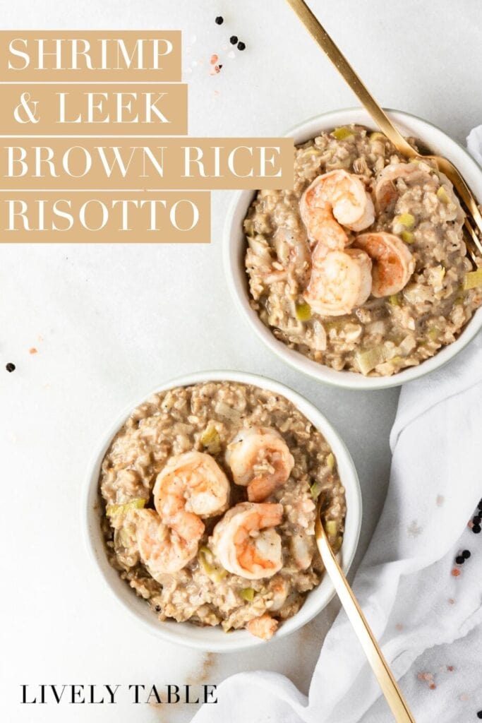 overhead view of two bowls of brown rice shrimp and leek risotto with gold forks in them with text overlay.