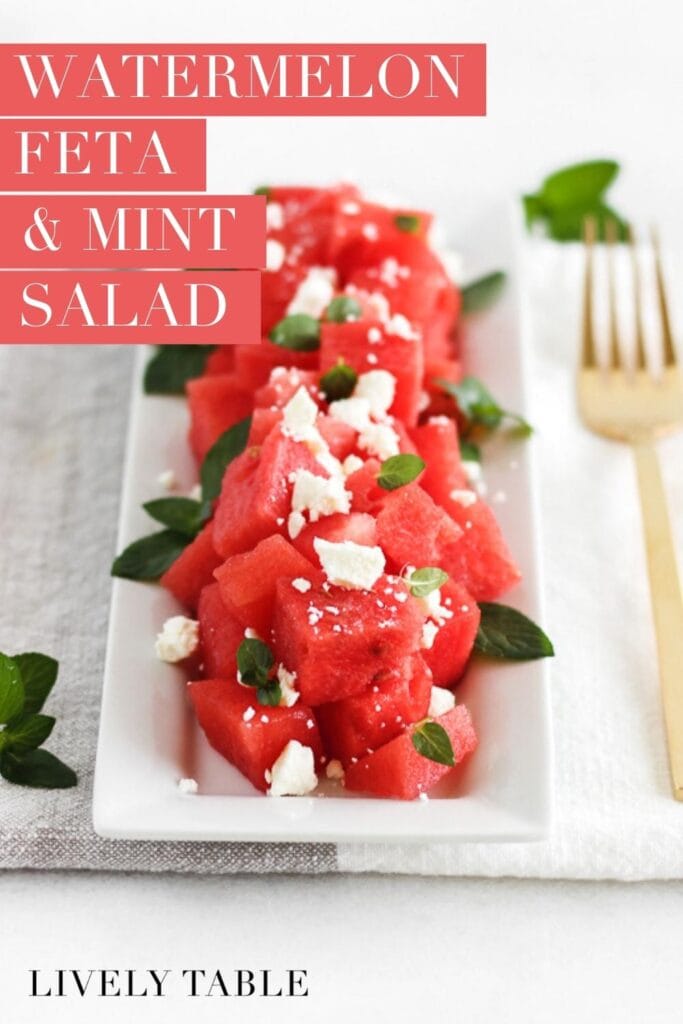 watermelon, feta and mint salad on a white square serving platter with a gold fork beside it with text overlay.