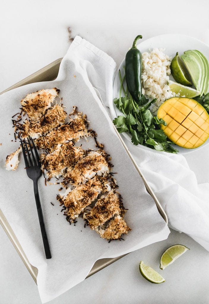 Coconut crusted fish on a pan out of the oven.
