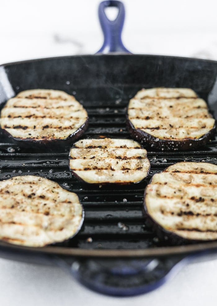 eggplant being grilled on a grill pan