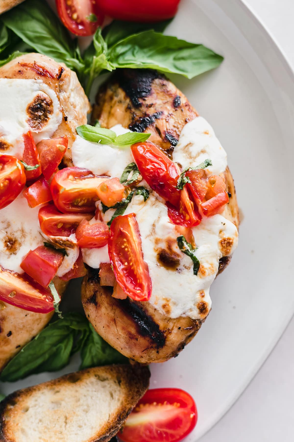 Close up of easy grilled bruschetta chicken on a plate.