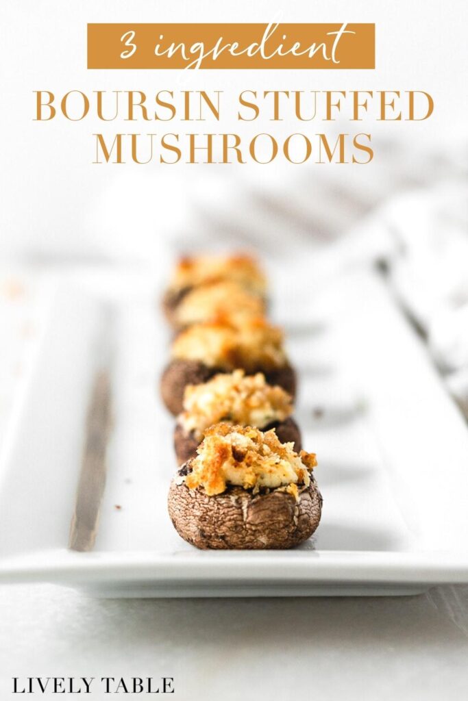 boursin stuffed mushrooms lined up on a white serving platter with text overlay.