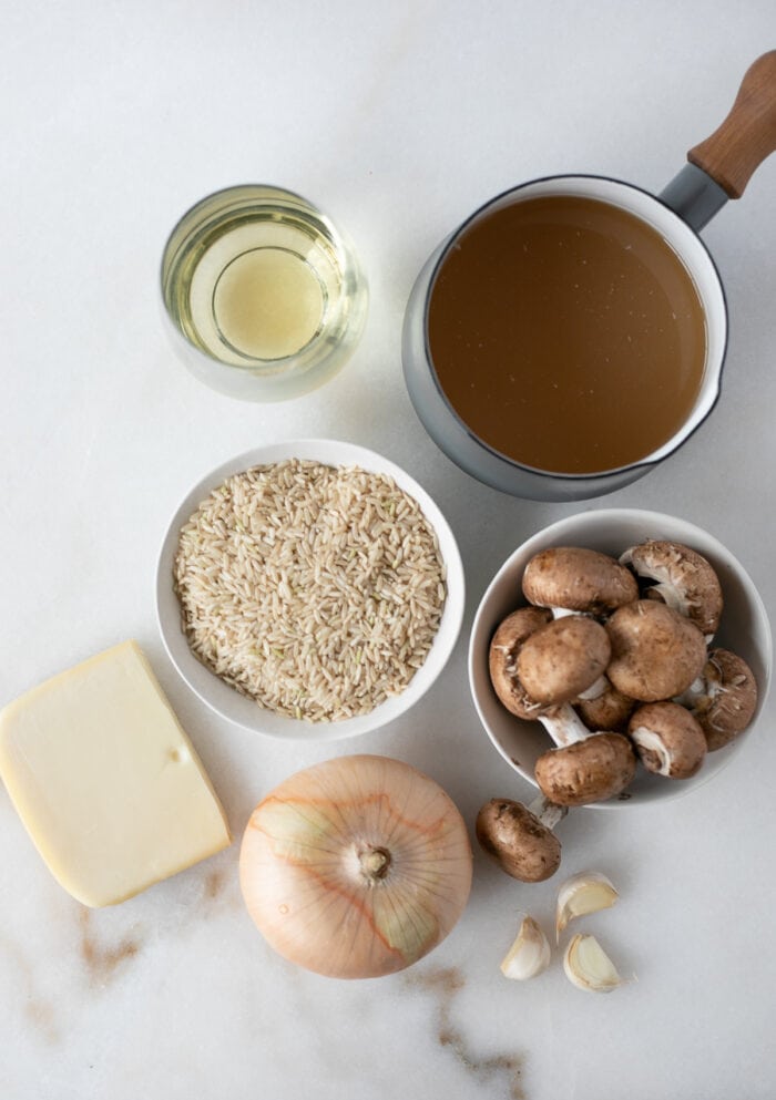 overhead view of ingredients needed to make brown rice mushroom risotto.