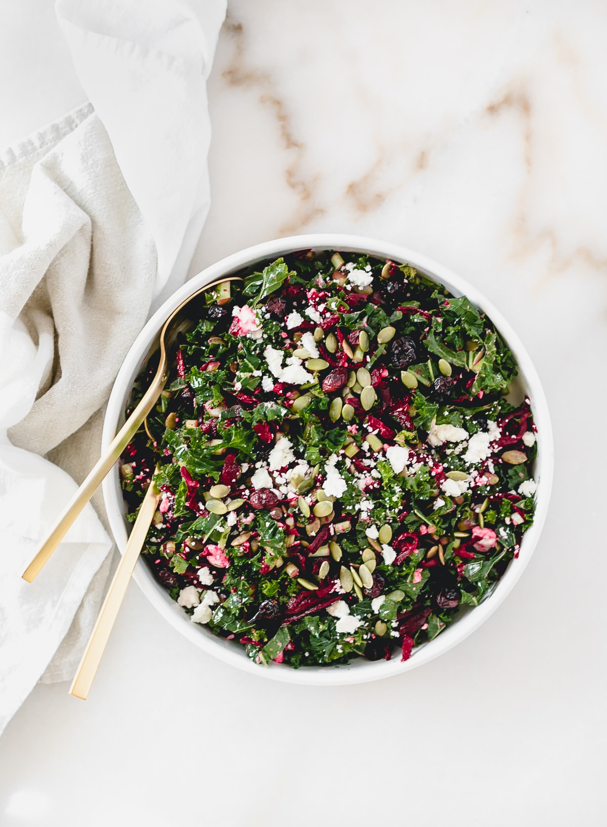 This delicious shredded beet kale salad is loaded with nutritious powerhouses like kale, roasted beets, pumpkin seeds, and dried cherries. It's the perfect winter salad! (gluten free, vegetarian, vegan option) via livelytable.com