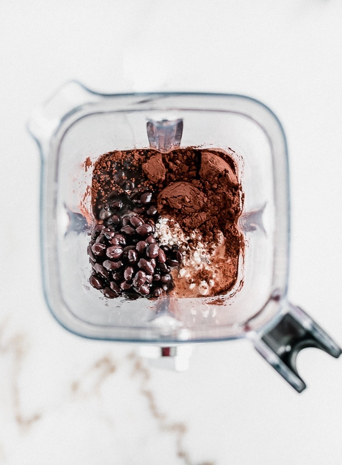 overhead view of ingredients for brownie batter dip in a blender.