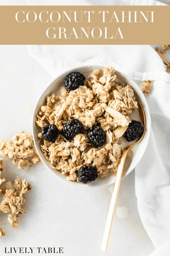 overhead view of tahini coconut granola and blackberries in a bowl with text overlay.