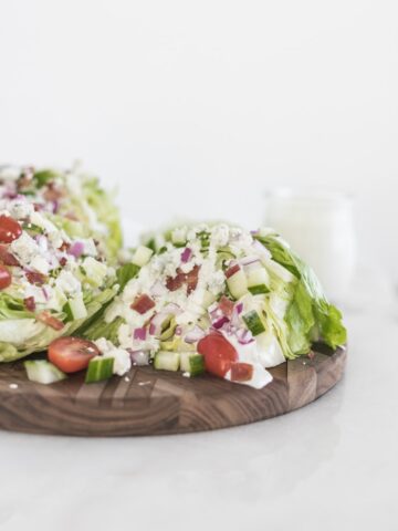 wedge salad on a wooden serving board.