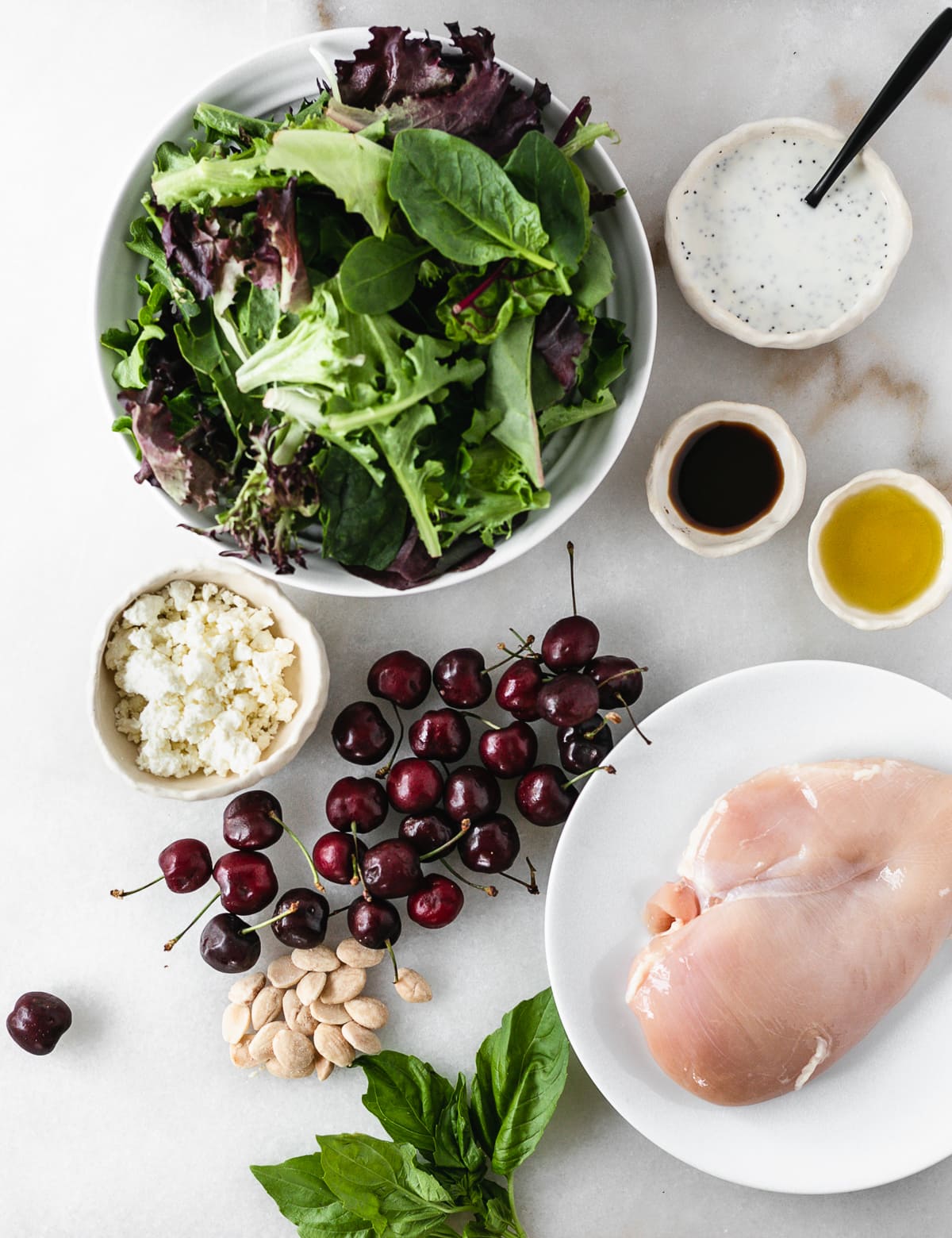 overhead view of ingredients needed for cherry almond grilled chicken salad.