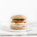 Healthy meal prep breakfast sandwich wrapped with a string on a white plate.