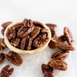 Easy 3 Ingredient Candied Pecans are sweet, crunchy, and perfect for the holidays! Add them to salads, oatmeal, or just snack on them. (gluten-free, refined sugar-free, vegan)