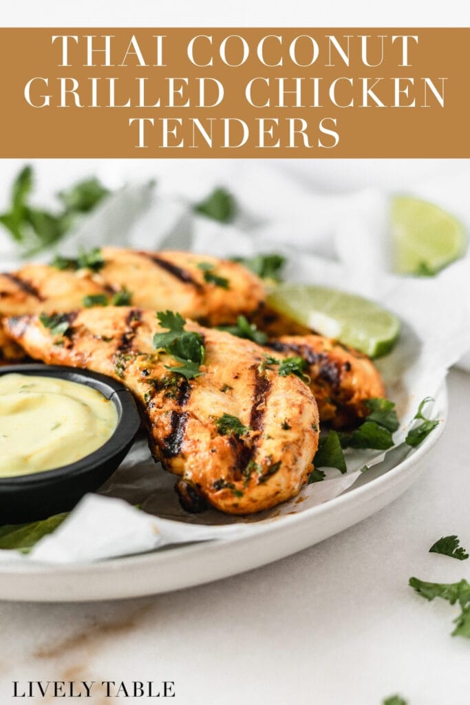closeup of thai coconut grilled chicken tenders on a plate with turmeric coconut dipping sauce with text overlay.