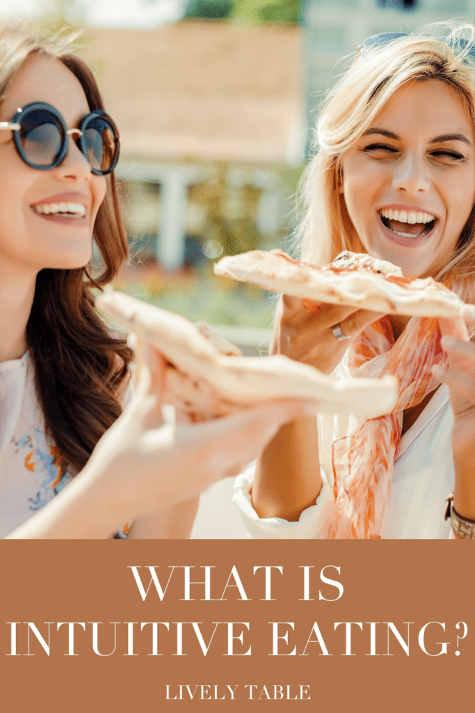 two women smiling and holding slices of pizza with text overlay.