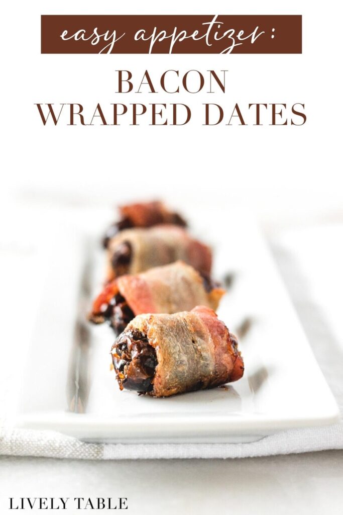bacon wrapped dates in a line on a white tray with text overlay.