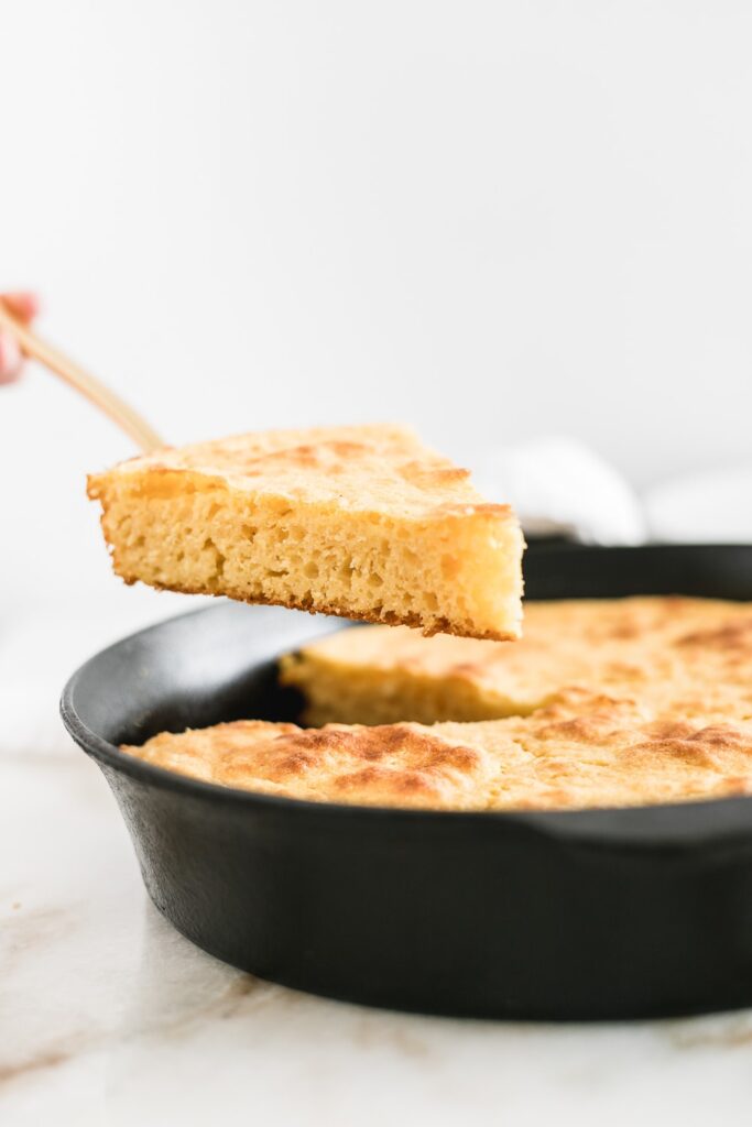 Close up of a slice of healthier skillet bread from the pan.
