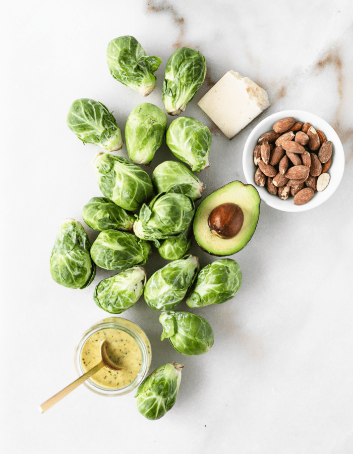 overhead view of ingredients needed for brussels sprouts chopped salad.