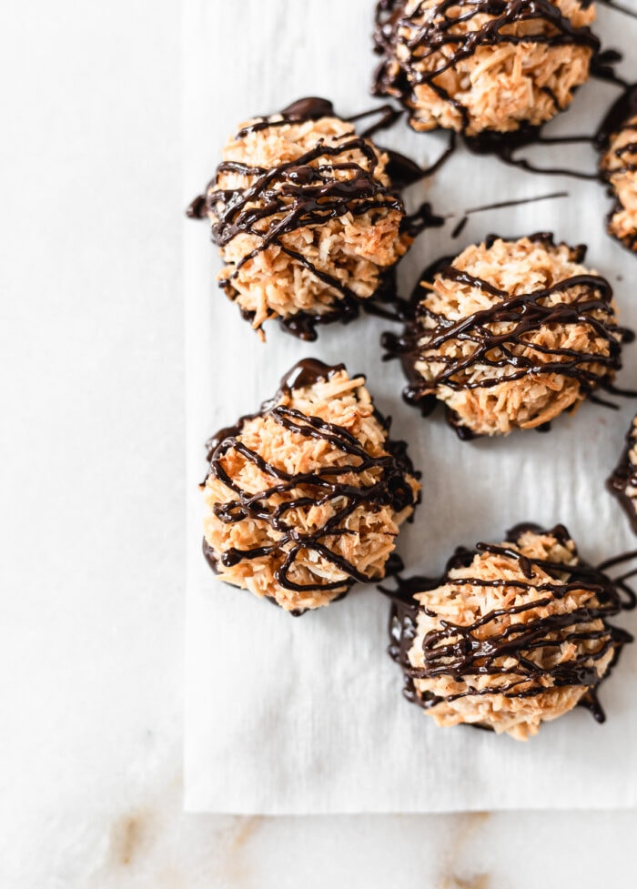 overhead view of almond joy coconut macaroon cookies drizzled with dark chocolate.