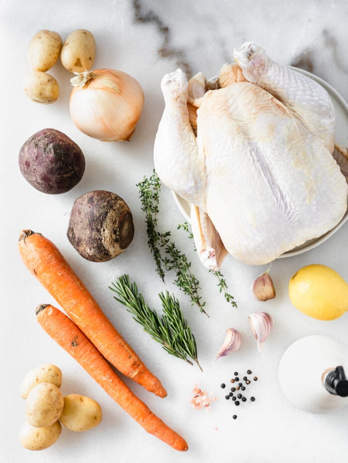 overhead view of ingredients needed to make roasted chicken with root vegetables.