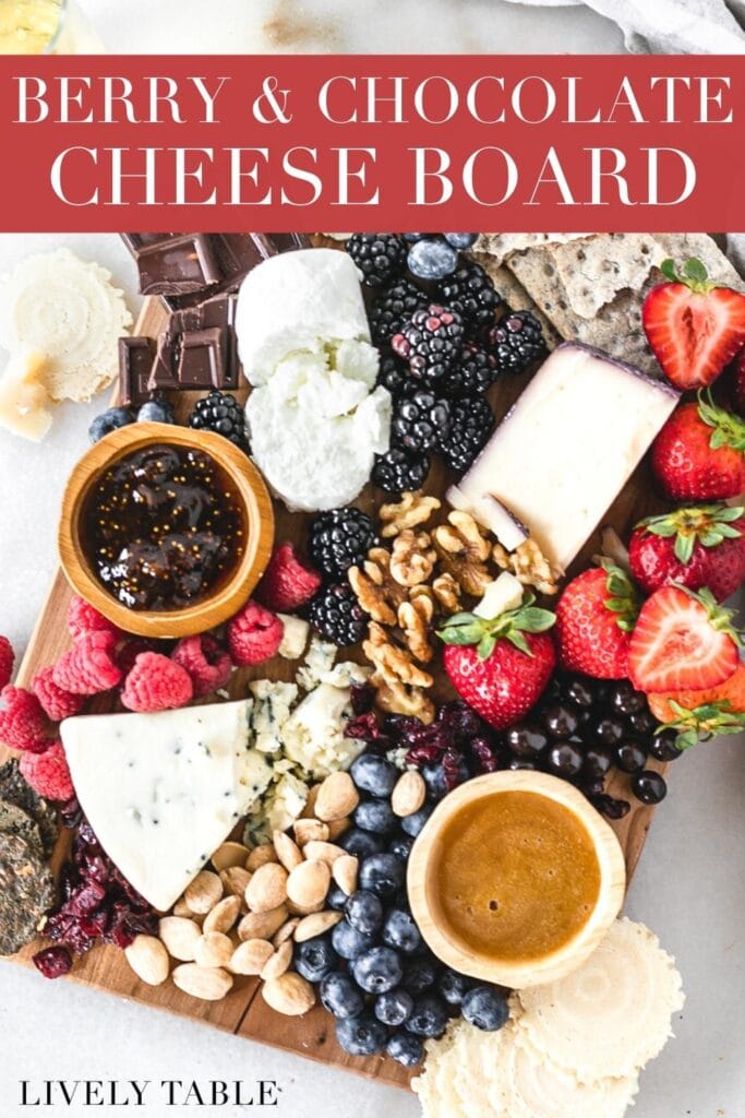 overhead view of a sweet berry and chocolate cheese board with text overlay.