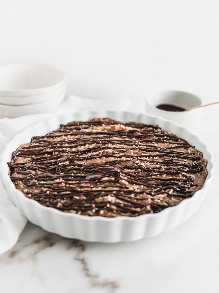 baked samoa oatmeal in a round white baking dish