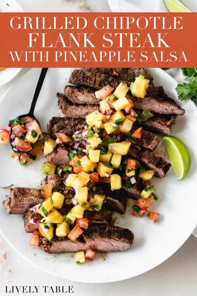 sliced chipotle flank steak topped with pineapple salsa on a white plate with text overlay.