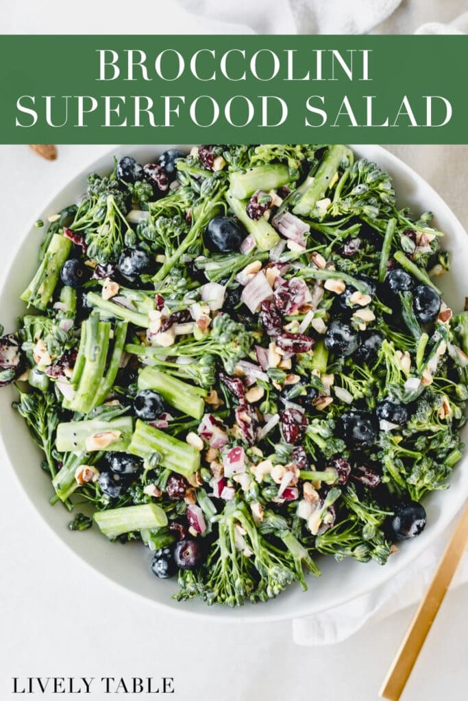 overhead view of broccolini superfood crunch salad in a white bowl with text overlay.