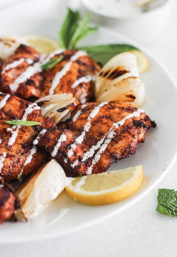 harissa grilled chicken thighs with lemon mint yogurt sauce