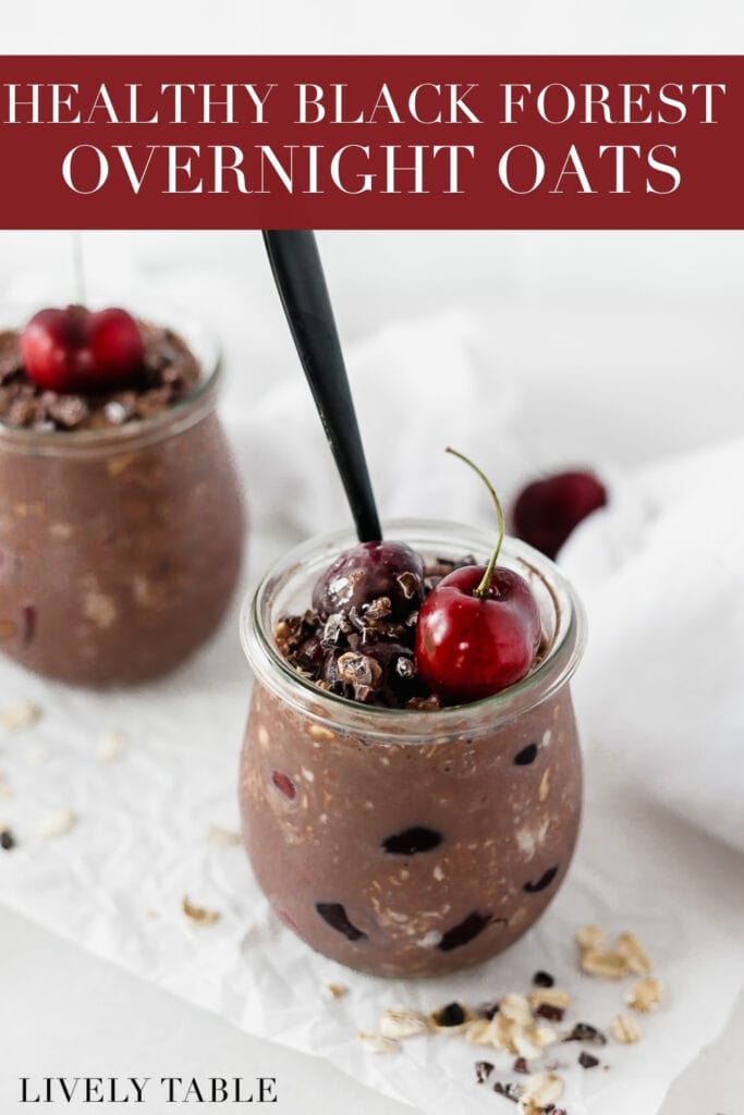 black forest overnight oats in a glass jar with a cherry on top with text overlay.