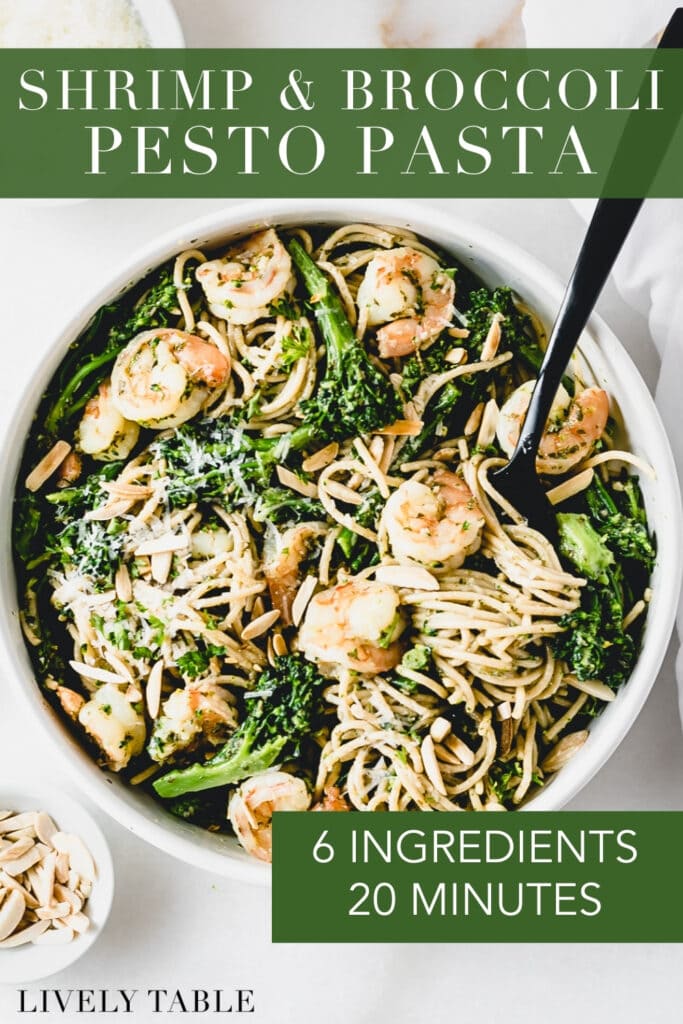overhead view of a bowl of shrimp and broccoli pesto pasta almondine with text overlay.