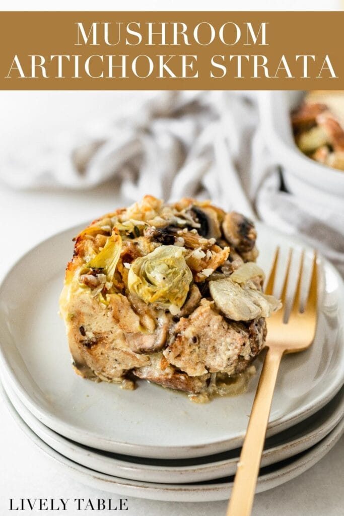 piece of mushroom artichoke strata with a gold fork on a stack of plates with text overlay.
