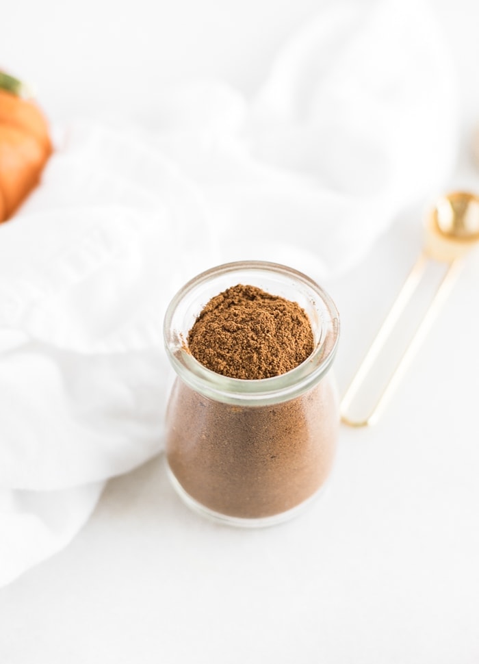 pumpkin pie spice in a small glass jar.