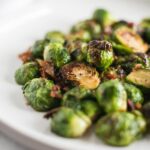 closeup of Bourbon Brown Sugar Roasted Brussels Sprouts with Bacon on a plate.