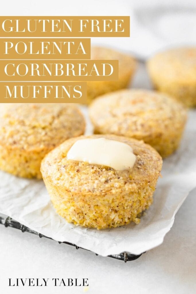 gluten free polenta cornbread muffins with butter on the front one on a parchment lined cooling rack with text overlay.