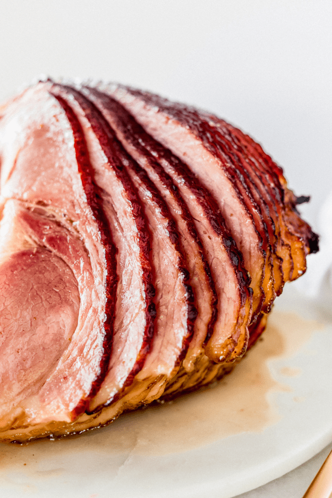 closeup of spiral sliced maple brown sugar glazed ham.