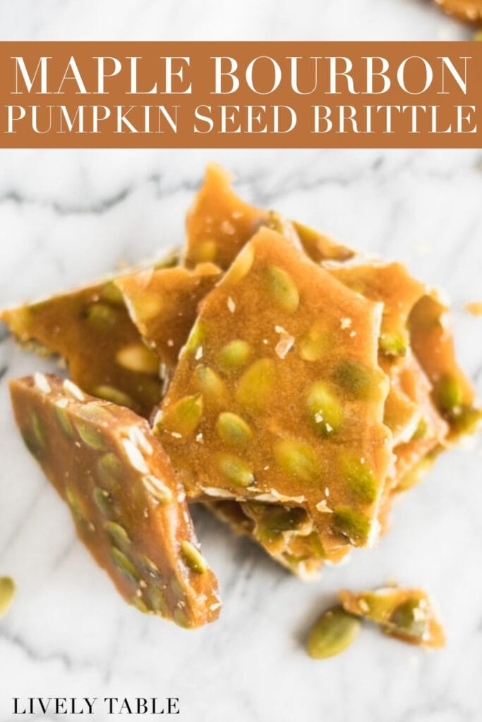 overhead view of stacked maple bourbon pumpkin seed brittle with text overlay.