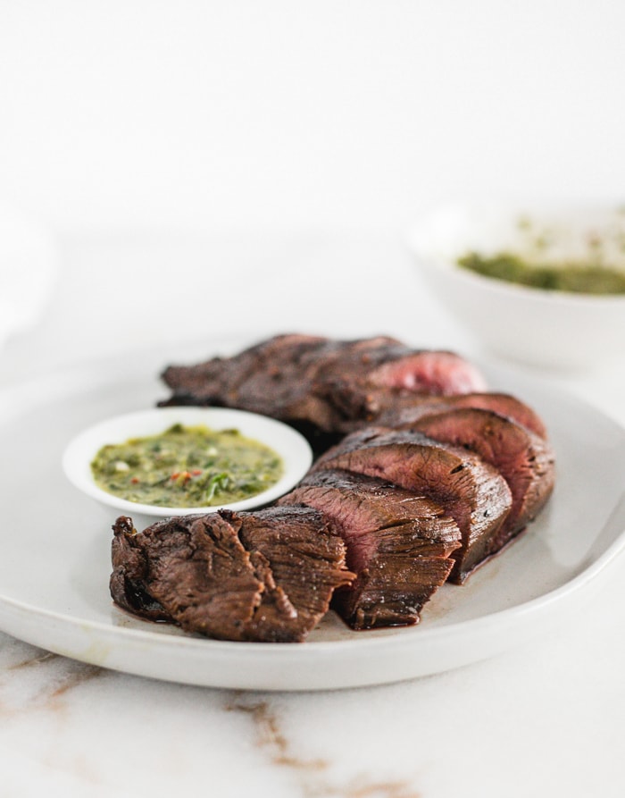 Easy seared venison tenderloin with chimichurri sauce is a healthy, delicious dinner! #maindish #venison #chimichurri #healthy #dinner