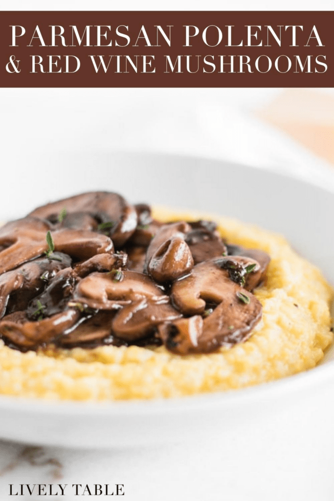 bowl of parmesan polenta topped with with red wine mushrooms with text overlay.