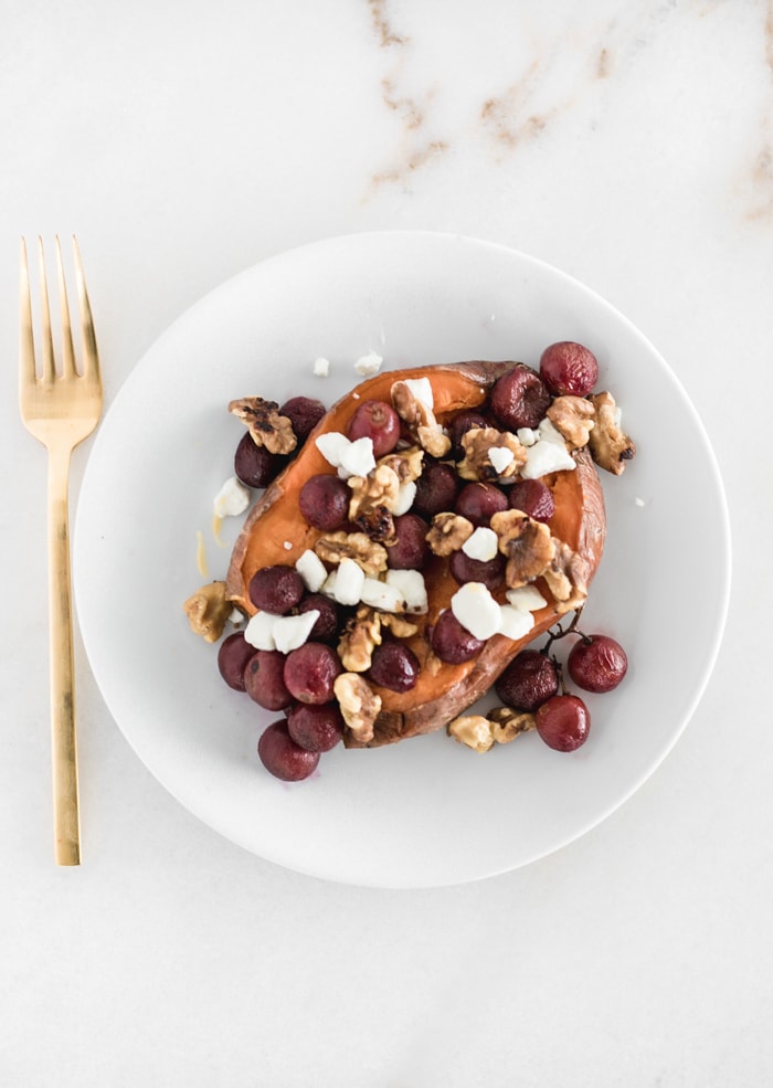 sweet potato stuffed with roasted grapes, goat cheese, walnuts and honey