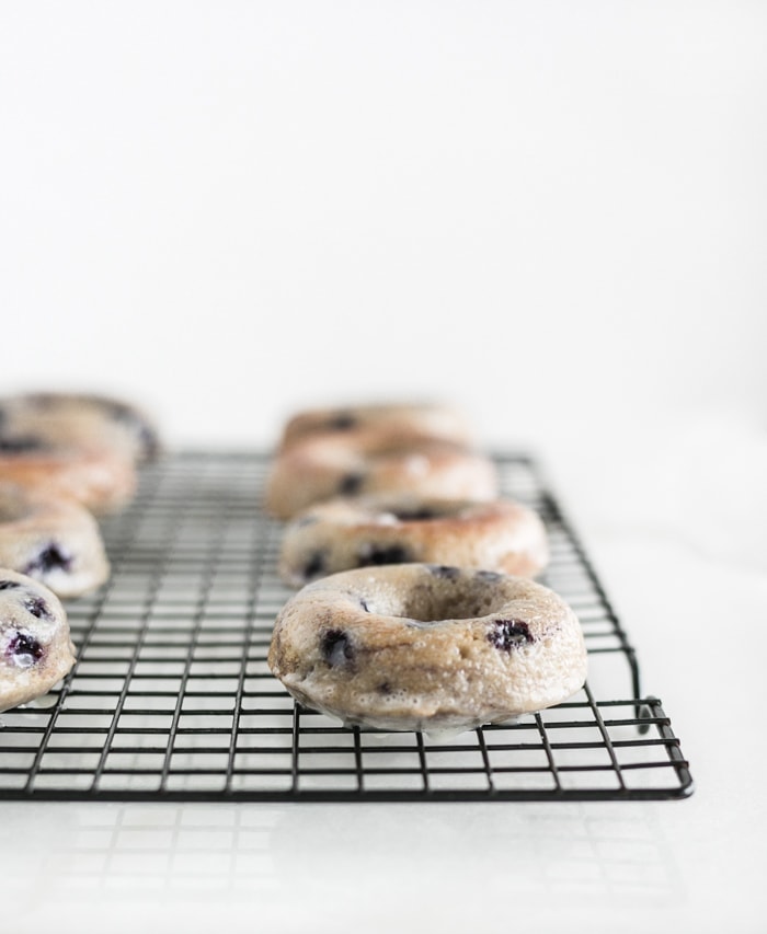 blueberry baked donuts on cooling rack