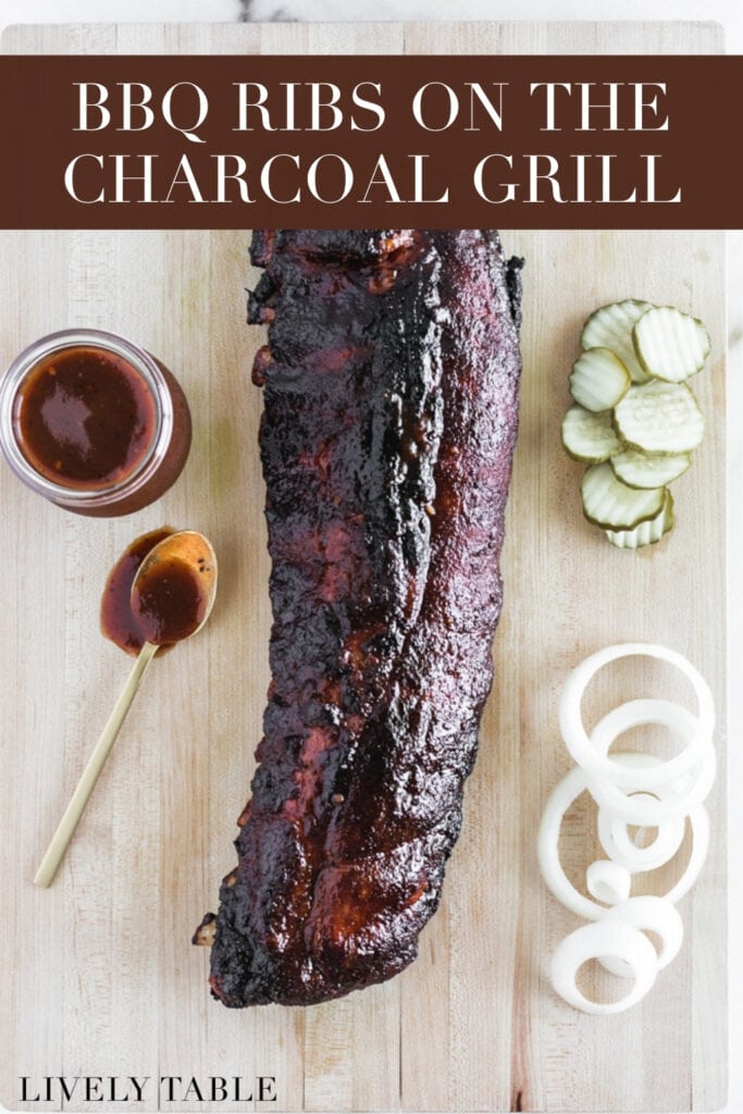 rack of grilled ribs on a wooden cutting board surrounded by pickles, onion slices, and BBQ sauce with text overlay.