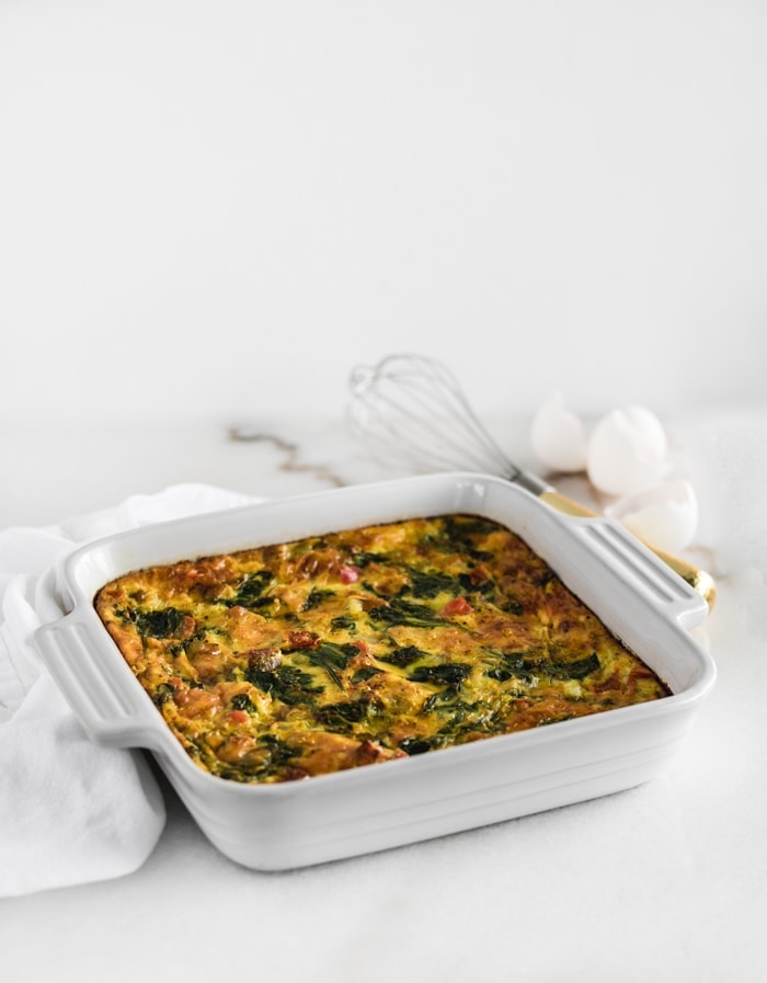 sweet potato veggie breakfast casserole in a white square dish