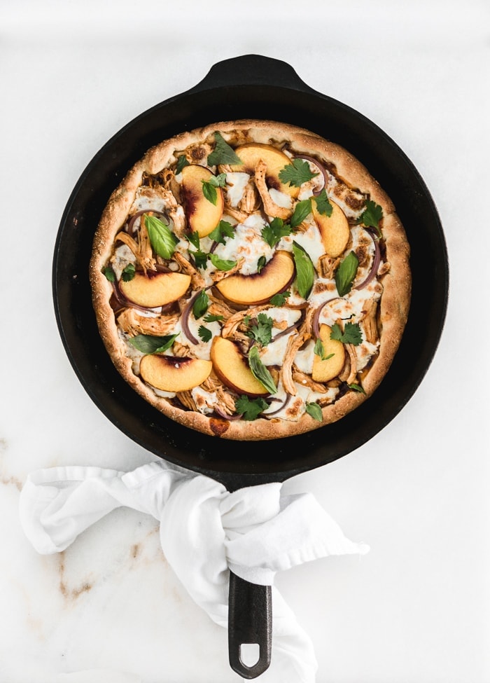 Peach BBQ Chicken Pizza in a cast iron skillet.