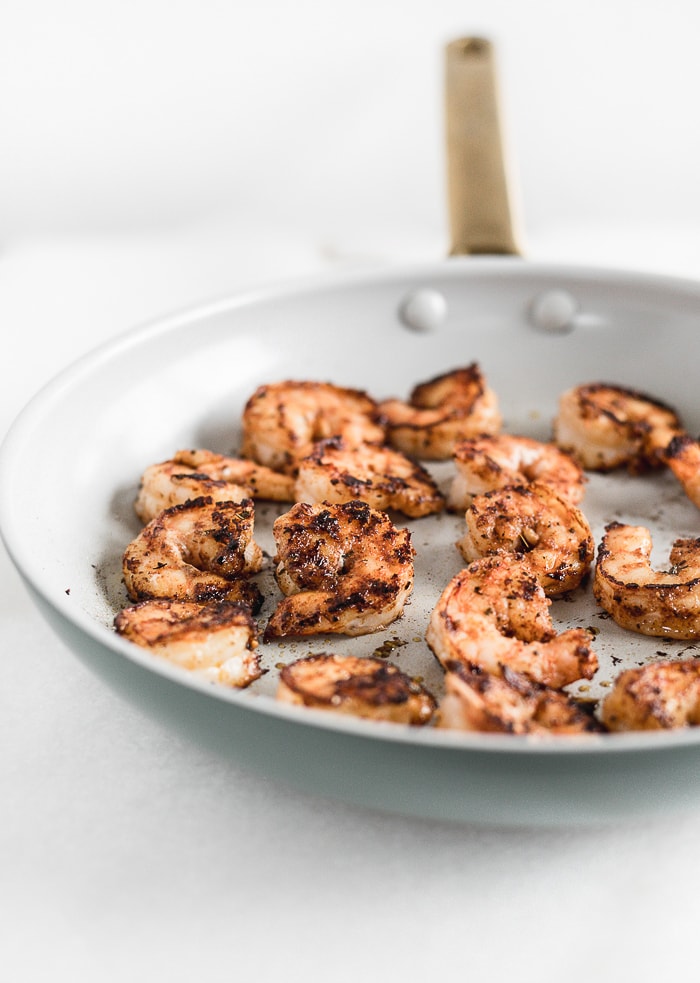 blackened shrimp in a skillet.